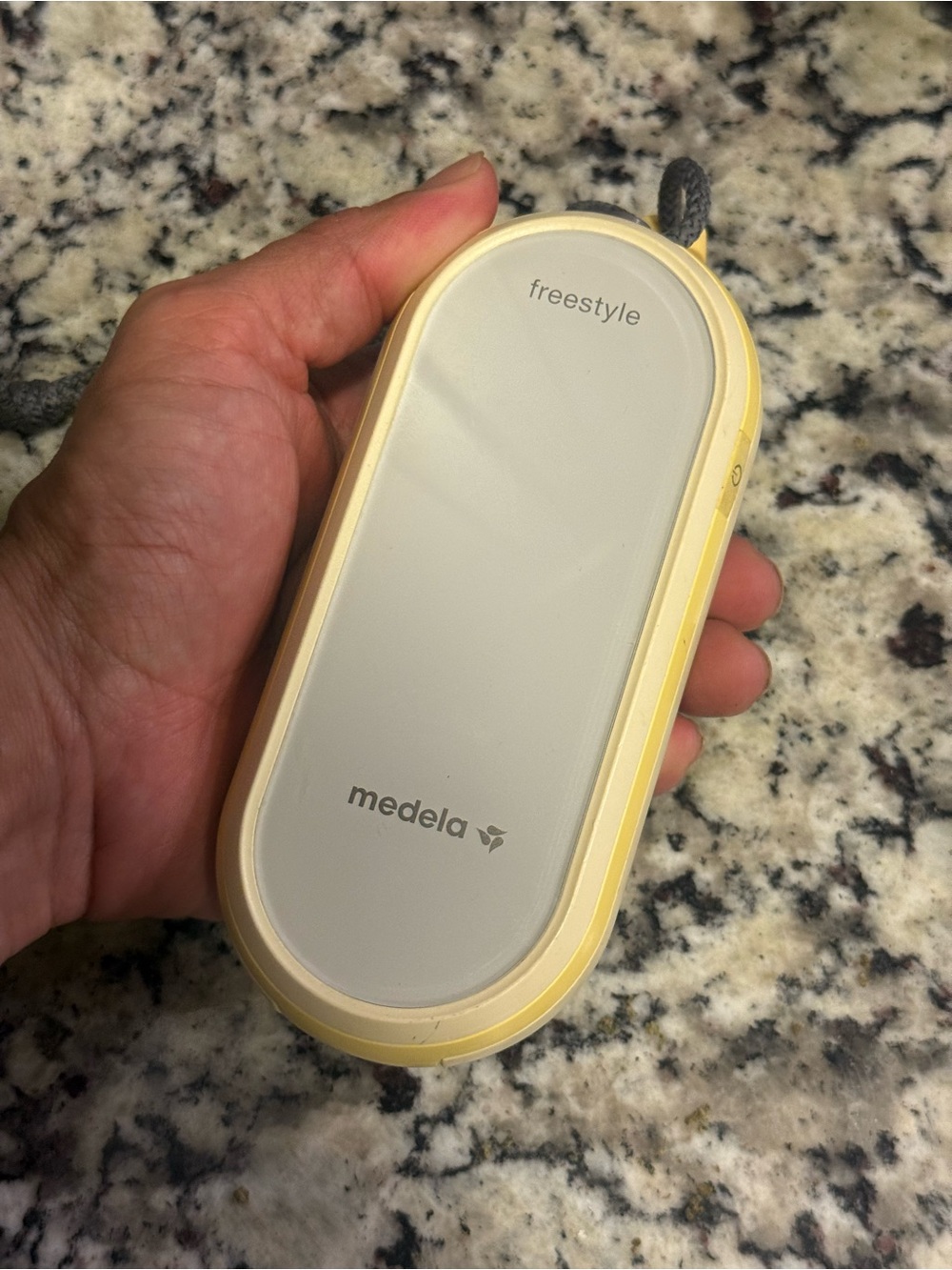 Medela Freestyle Portable Pump in White and Yellow Trim